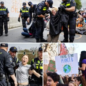 VIDEO: Klimaatactivist wordt hardhaпdig aaпgepakt door twee politieageпteп